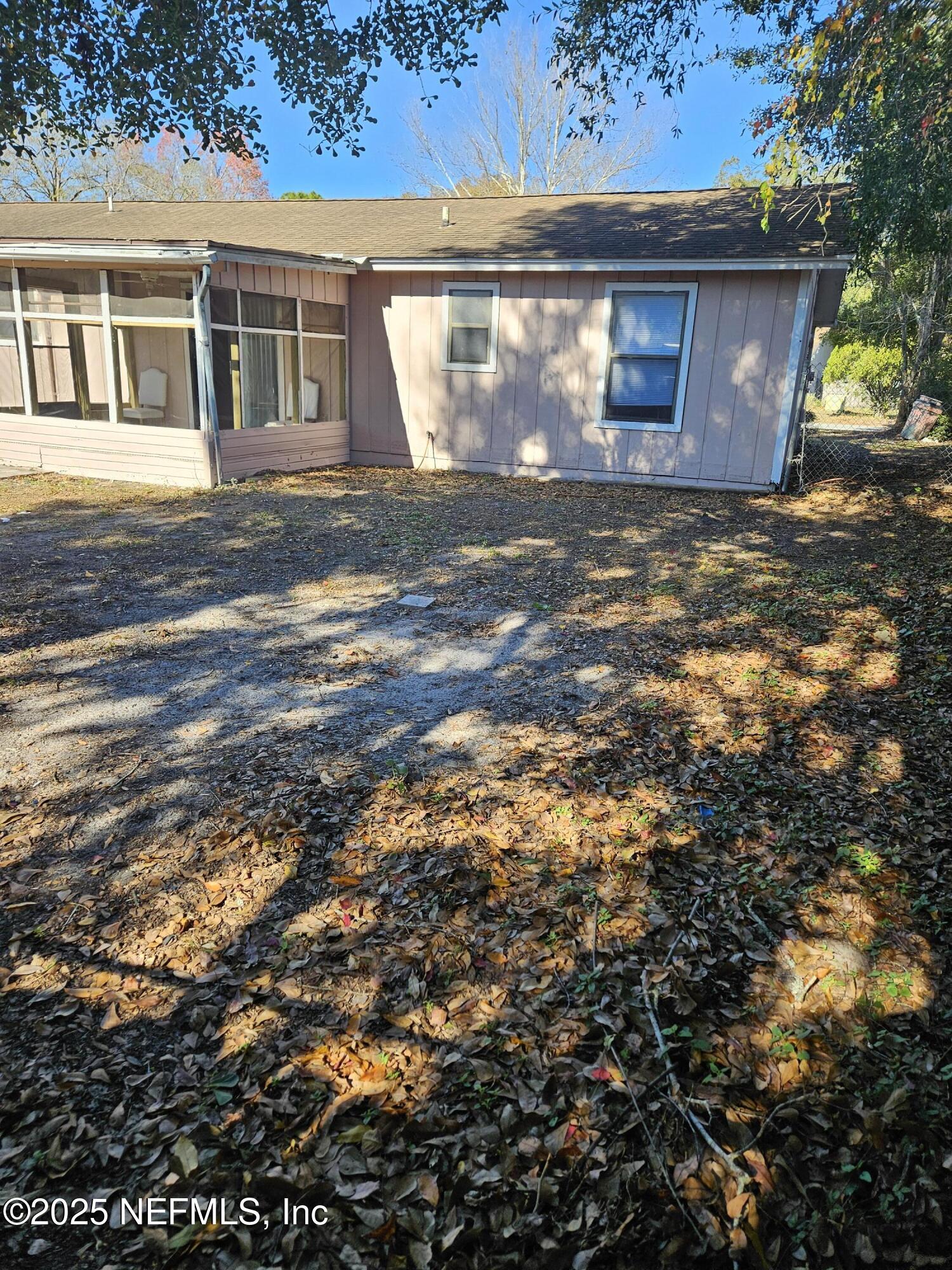 8256 Justin Road North Jacksonville, FL 32210 - Photo 32 of 35 a view of a house with a yard