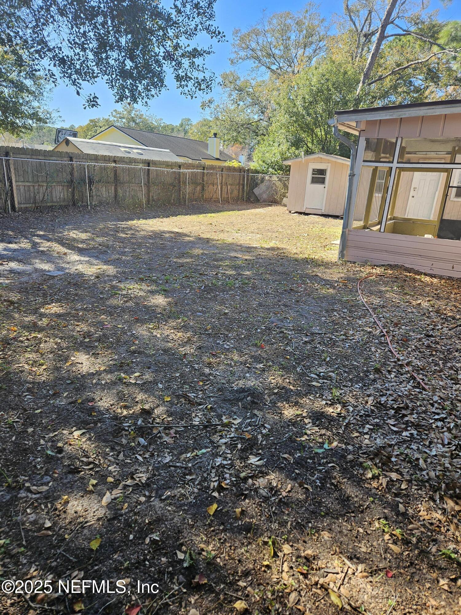 8256 Justin Road North Jacksonville, FL 32210 - Photo 33 of 35 a view of a house with a yard