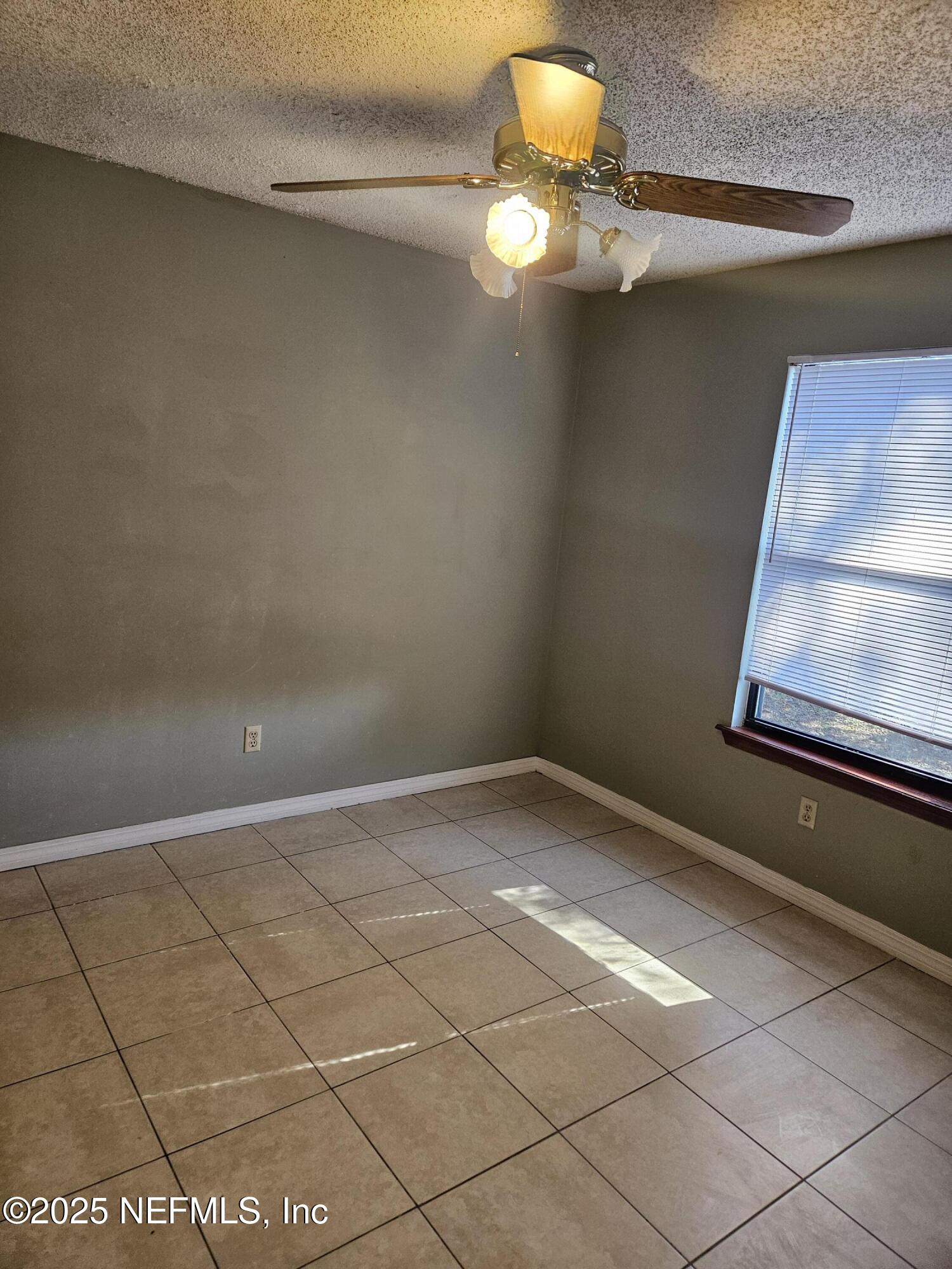 8256 Justin Road North Jacksonville, FL 32210 - Photo 10 of 35 a view of an empty room with a window