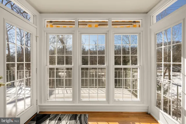 a very nice looking room with a large window and chandelier