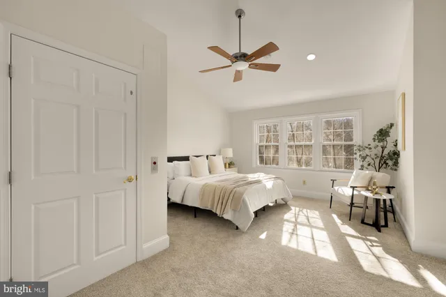 a bathroom with a granite countertop sink a large mirror a shower and a bathtub