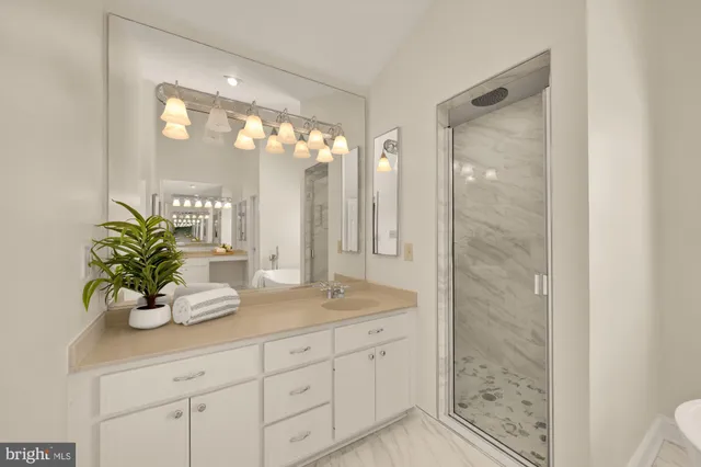 an empty room with windows and ceiling fan