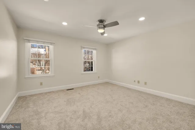 a view of a bathroom from a hallway