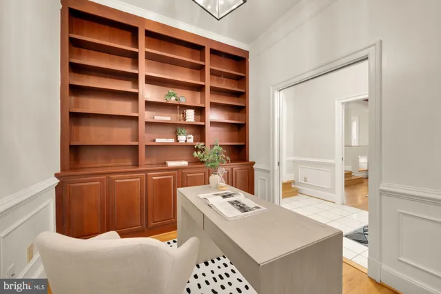 a bathroom with a sink a potted plant and a toilet