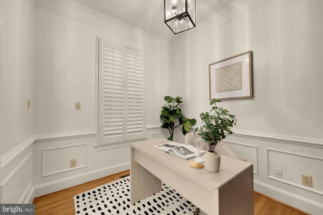 a living room with furniture a fireplace and a large window