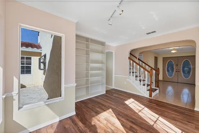 a kitchen with a sink cabinets and window