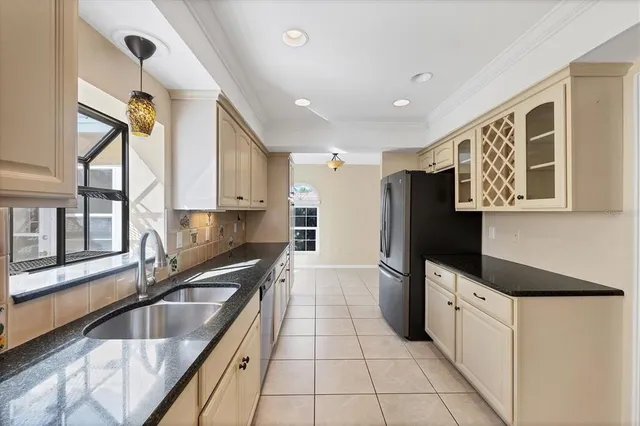 a large bathroom with a tub sink and mirror
