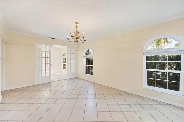 a view of washer and dryer with bathroom in the background