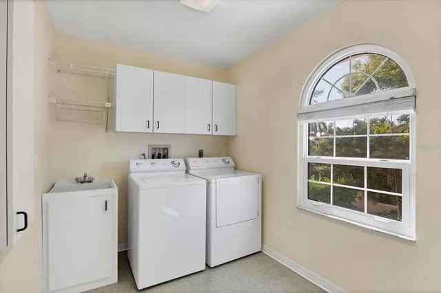 an aerial view of house with yard and mountain view in back