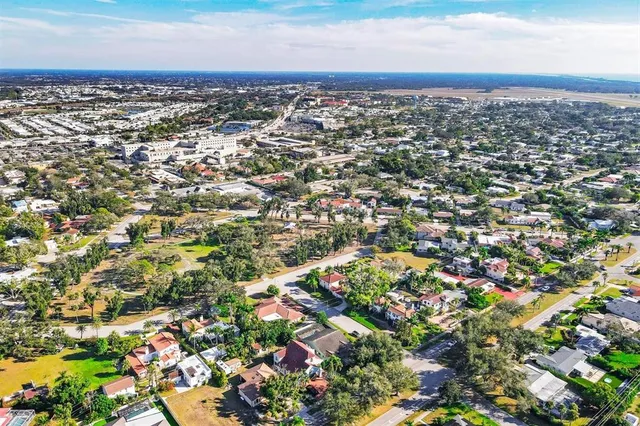 a front view of a house with a yard and a garage