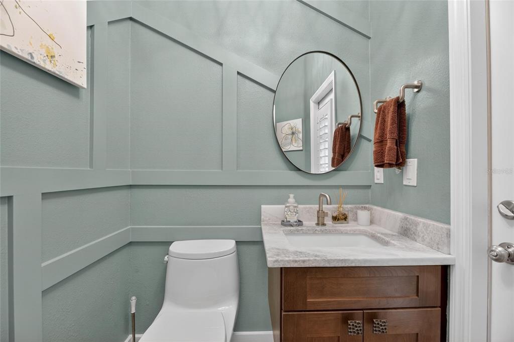 508 Islebay Drive Apollo Beach, FL 33572 - Photo 37 of 98 a bathroom with a toilet a sink and mirror