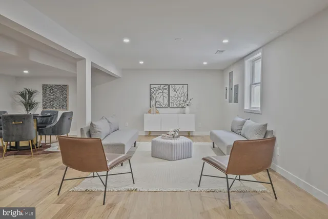 a living room with furniture and a chair