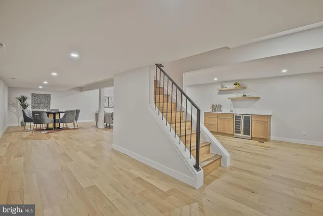 a view of a livingroom with furniture and stairs