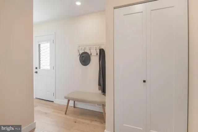 a view of a hallway with front door