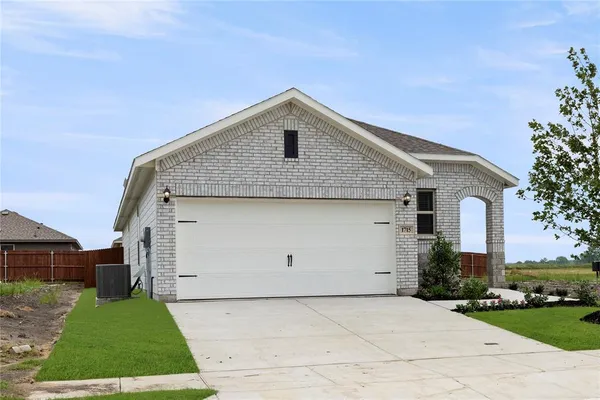 a house view with a garden space