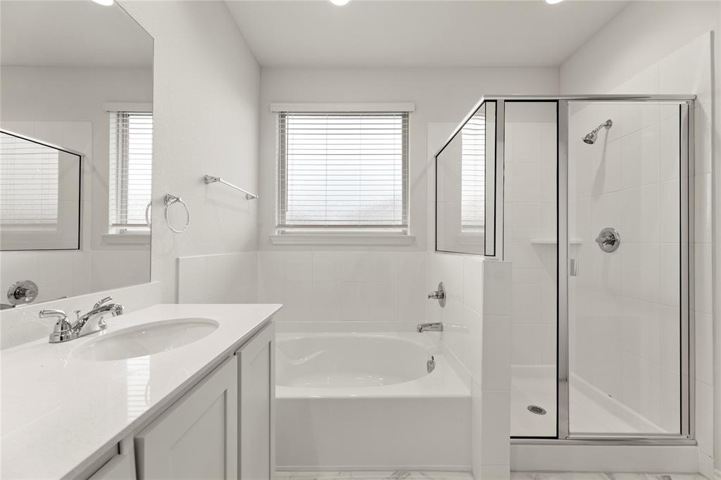 1715 Teton River Drive Blue Ridge, TX 75424 - Photo 22 of 28 a bathroom with a granite countertop sink a mirror and a shower
