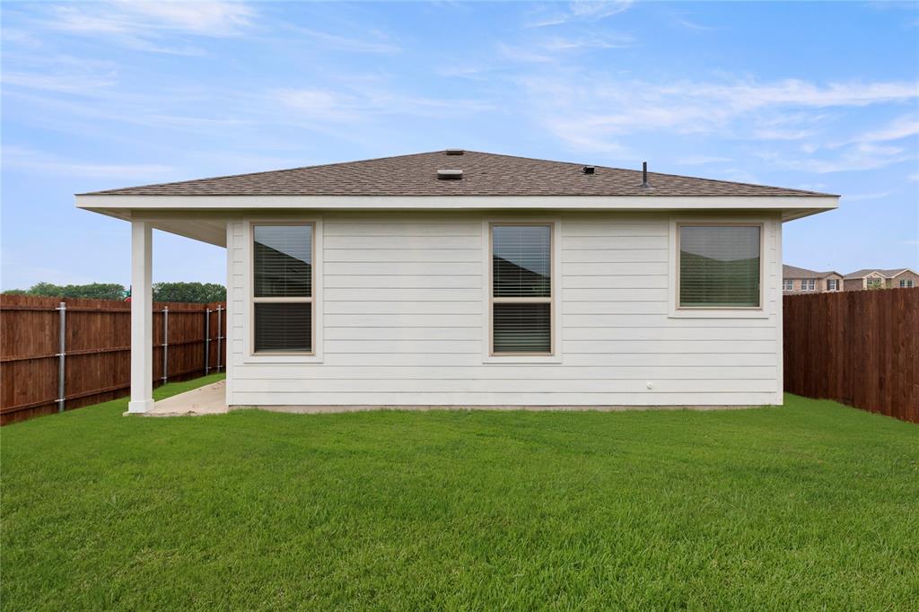 1715 Teton River Drive Blue Ridge, TX 75424 - Photo 26 of 28 a front view of a house with a yard