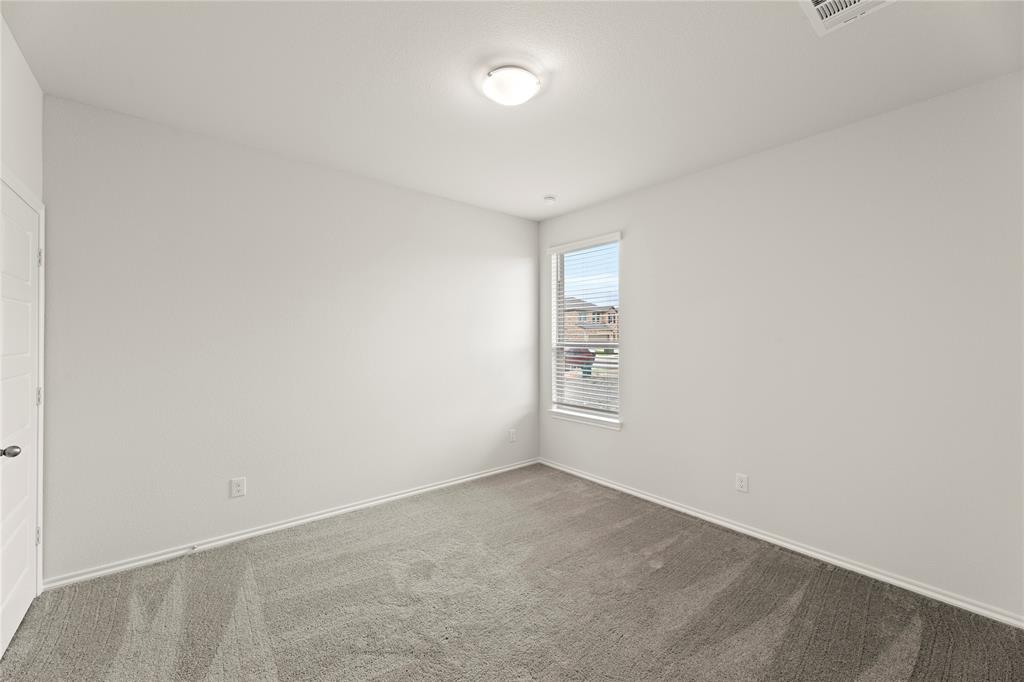 1715 Teton River Drive Blue Ridge, TX 75424 - Photo 8 of 28 an empty room with a empty space and windows