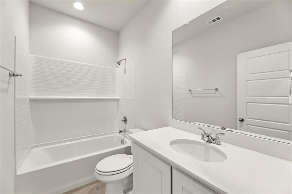 1715 Teton River Drive Blue Ridge, TX 75424 - Photo 9 of 28 a bathroom with a sink a toilet and shower