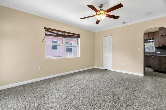 a view of an empty room with a window