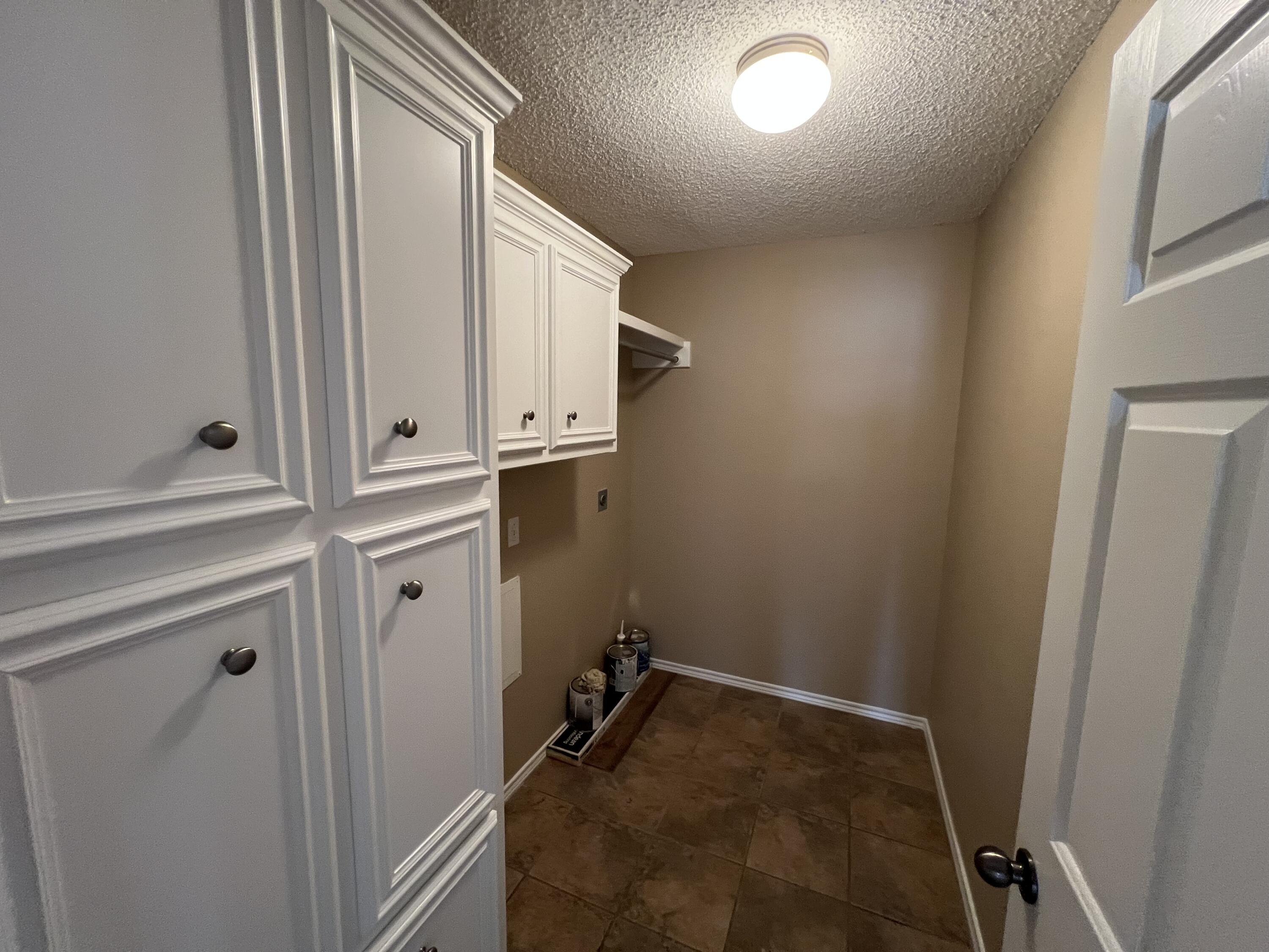 6505 8th Street Lubbock, TX 79416 - Photo 12 of 12 a view of storage and utility room with closet
