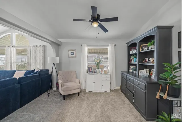 a living room with furniture and a window