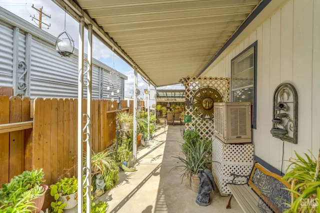 a front view of a house with outdoor seating