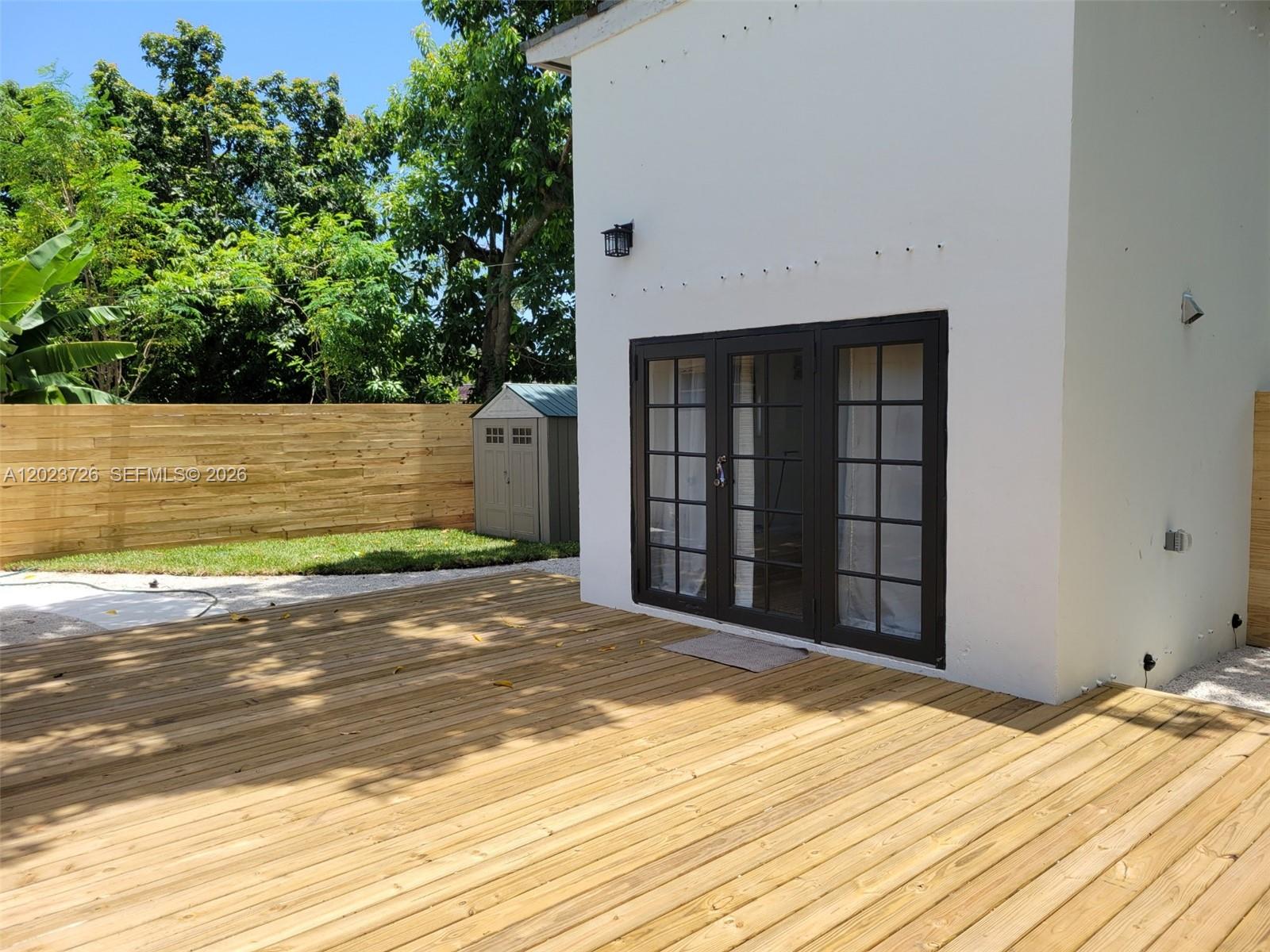5866 Southwest 60th Street, Unit 3 Miami, FL 33143 - Photo 7 of 8 a view of a backyard of a house