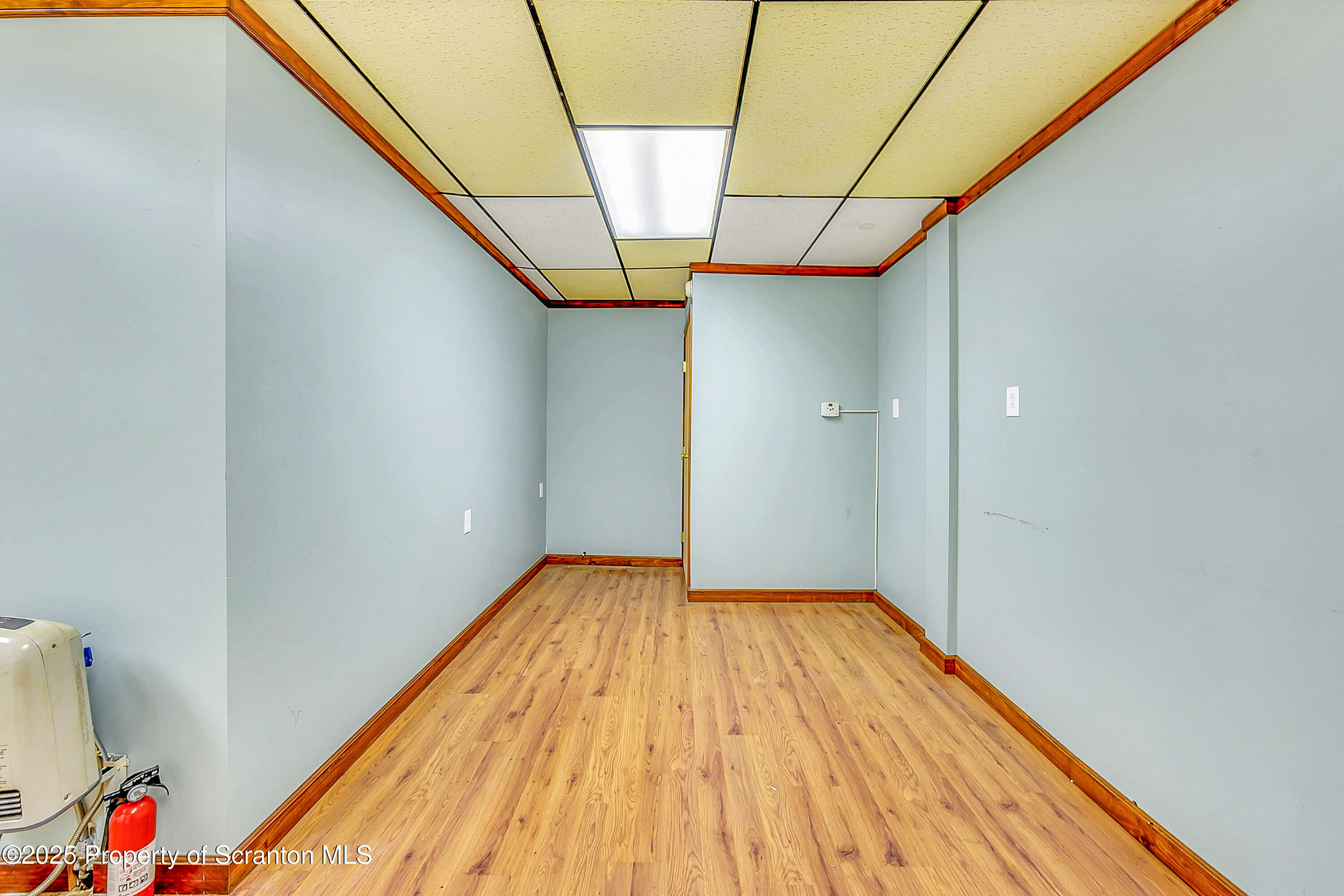 807 Columbus Avenue Blakely, PA 18447 - Photo 12 of 37 a view of empty room with wooden floor