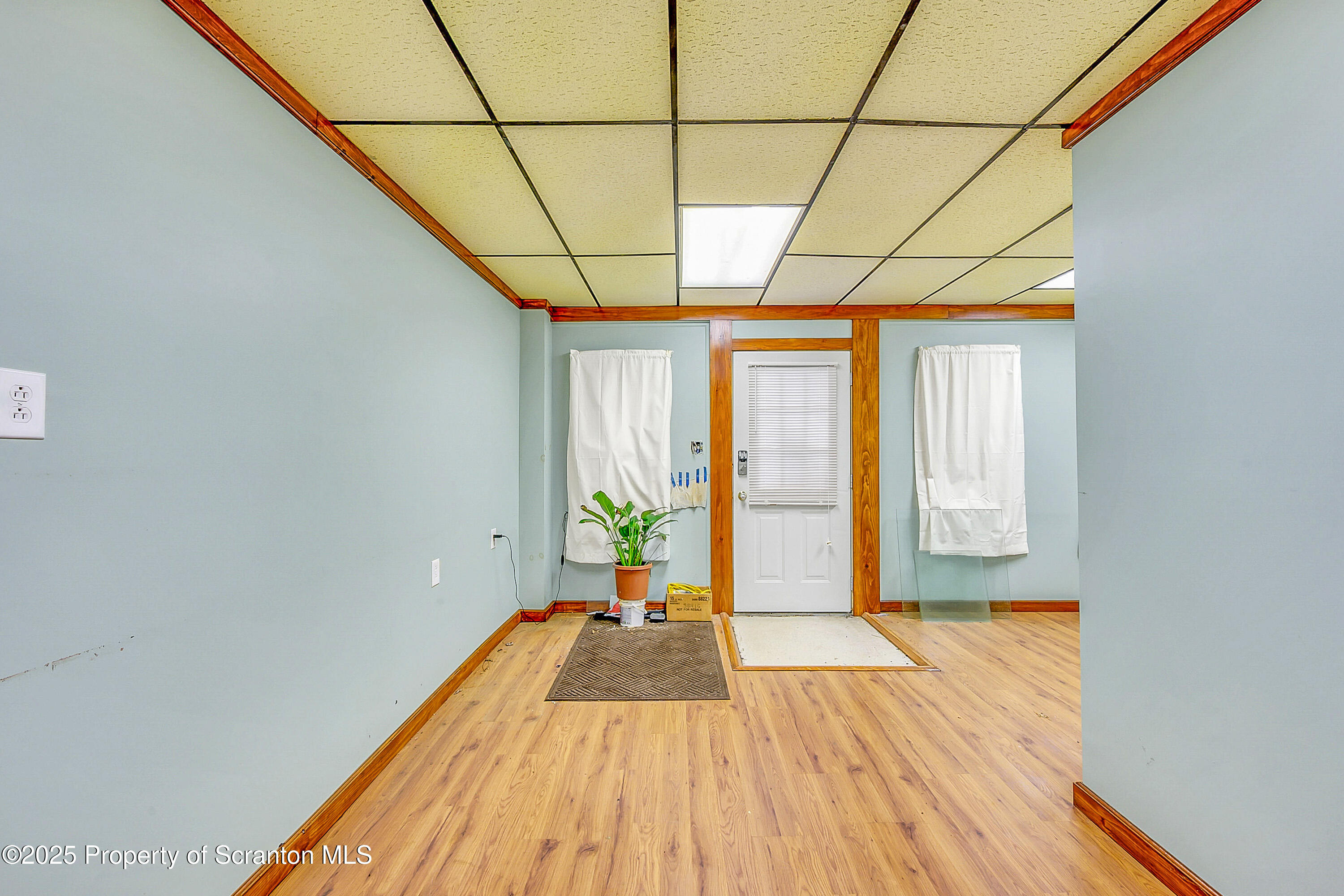 807 Columbus Avenue Blakely, PA 18447 - Photo 13 of 37 a view of a room with wooden floor and windows