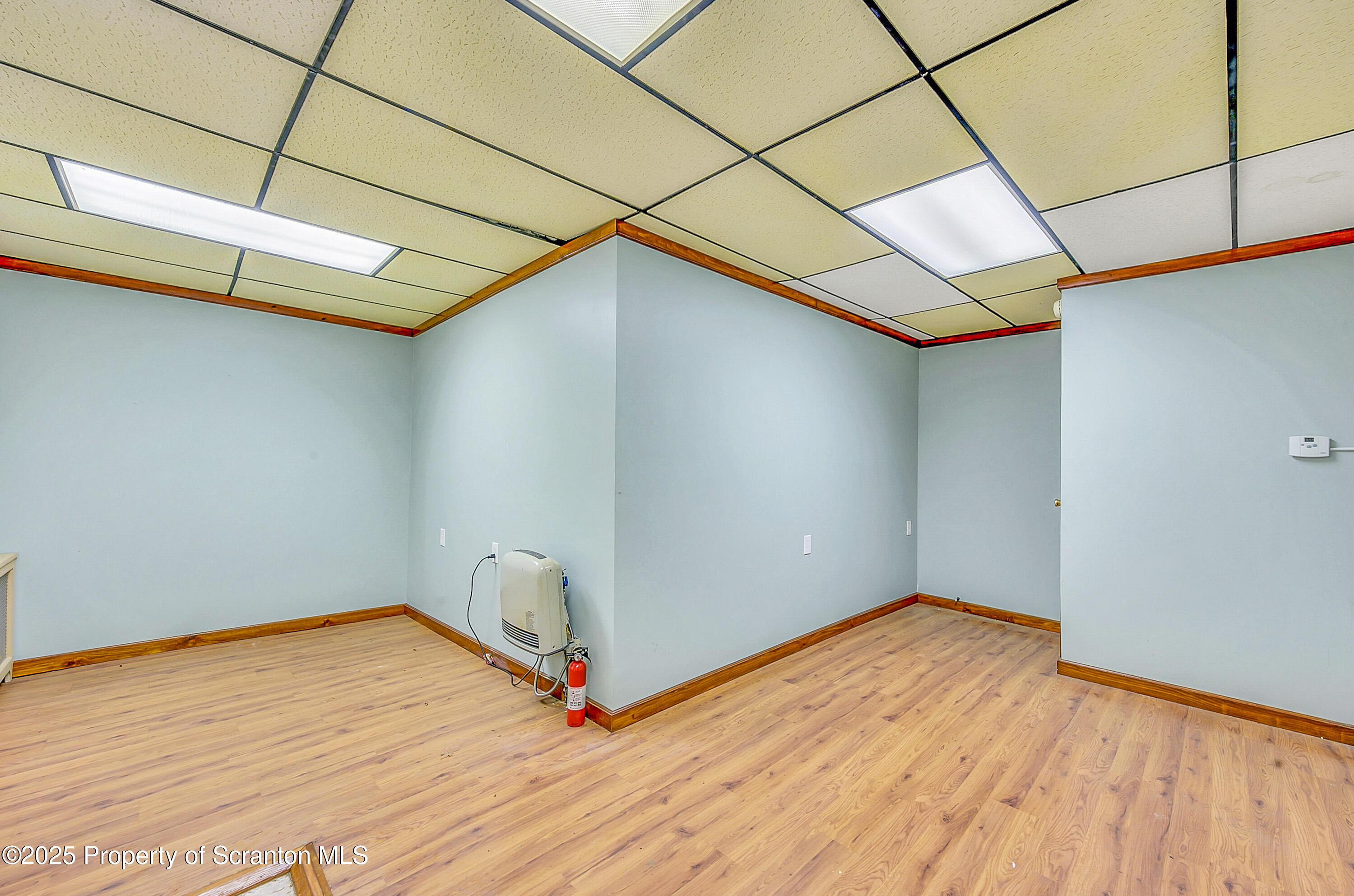 807 Columbus Avenue Blakely, PA 18447 - Photo 14 of 37 a view of empty room with wooden floor