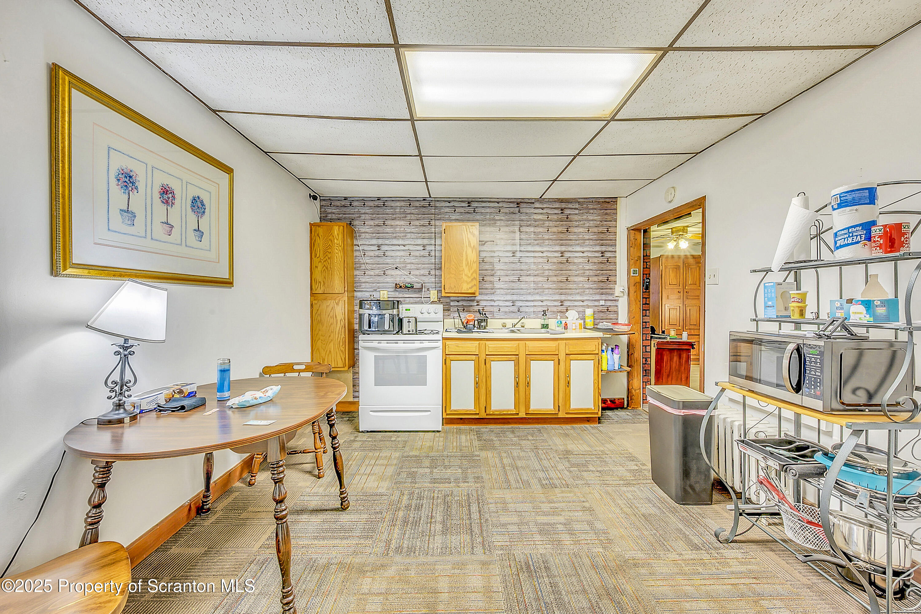 807 Columbus Avenue Blakely, PA 18447 - Photo 16 of 37 a room with lots of table and chair