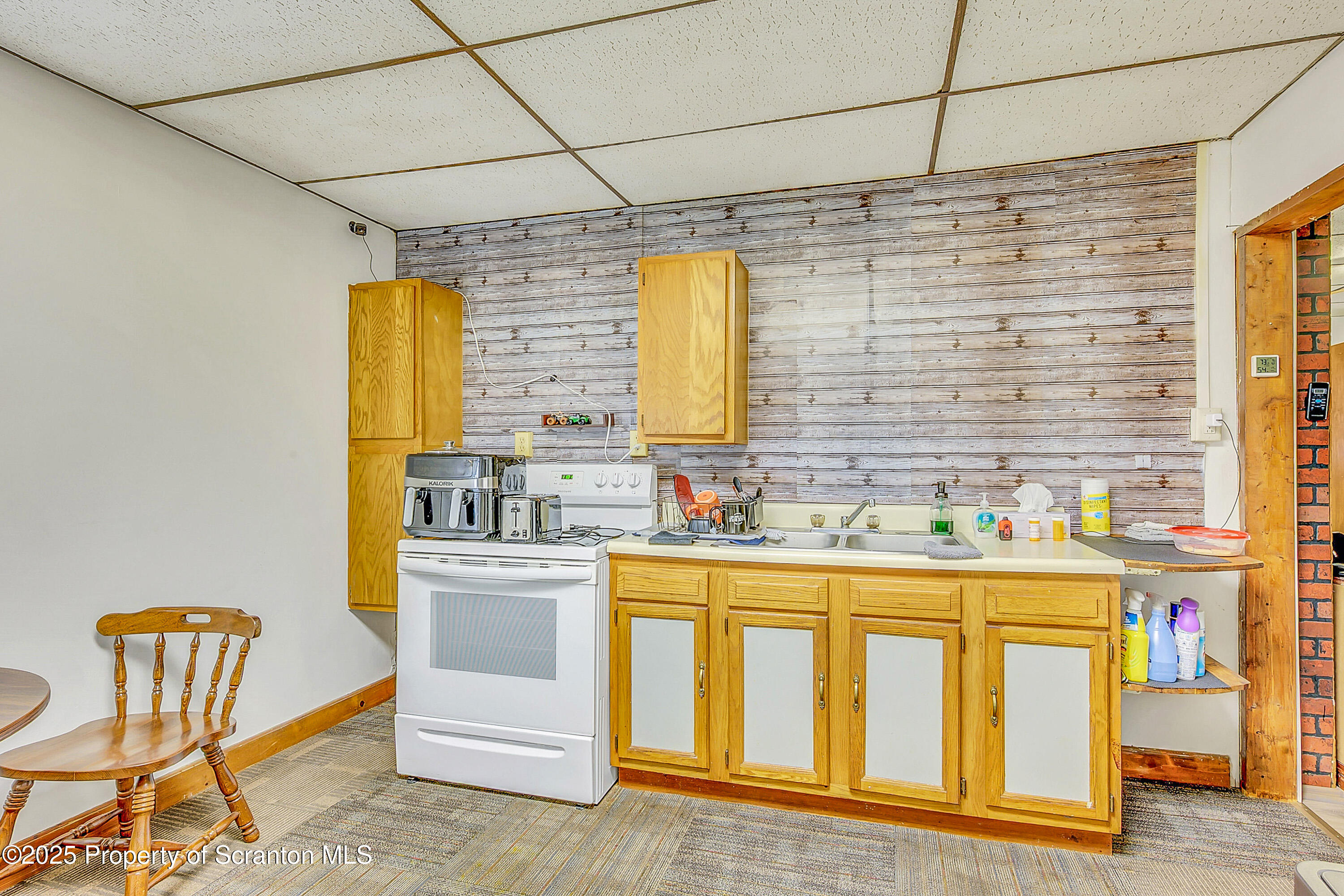 807 Columbus Avenue Blakely, PA 18447 - Photo 17 of 37 a kitchen with a sink cabinets and window