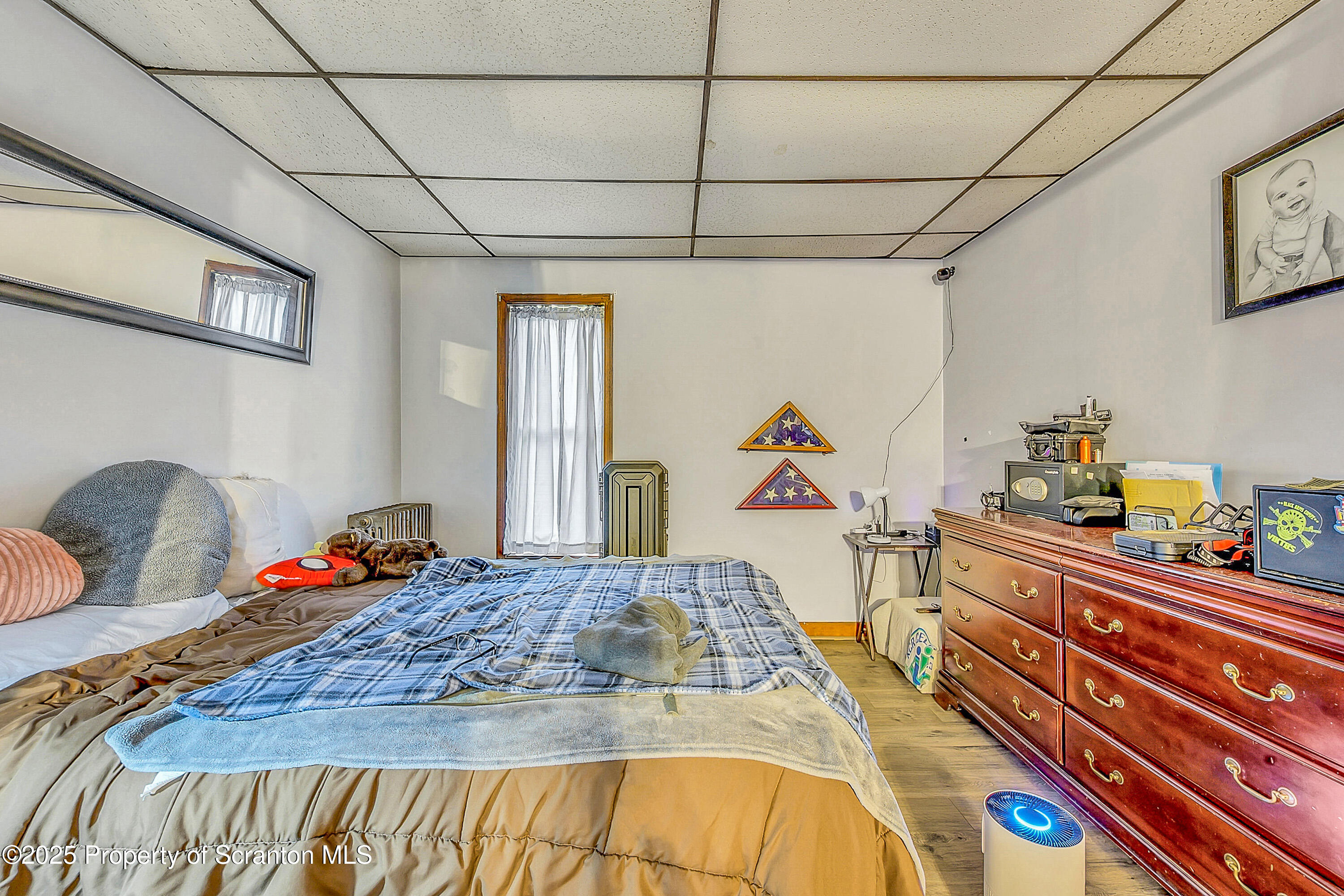 807 Columbus Avenue Blakely, PA 18447 - Photo 18 of 37 a bedroom with a bed and a dresser