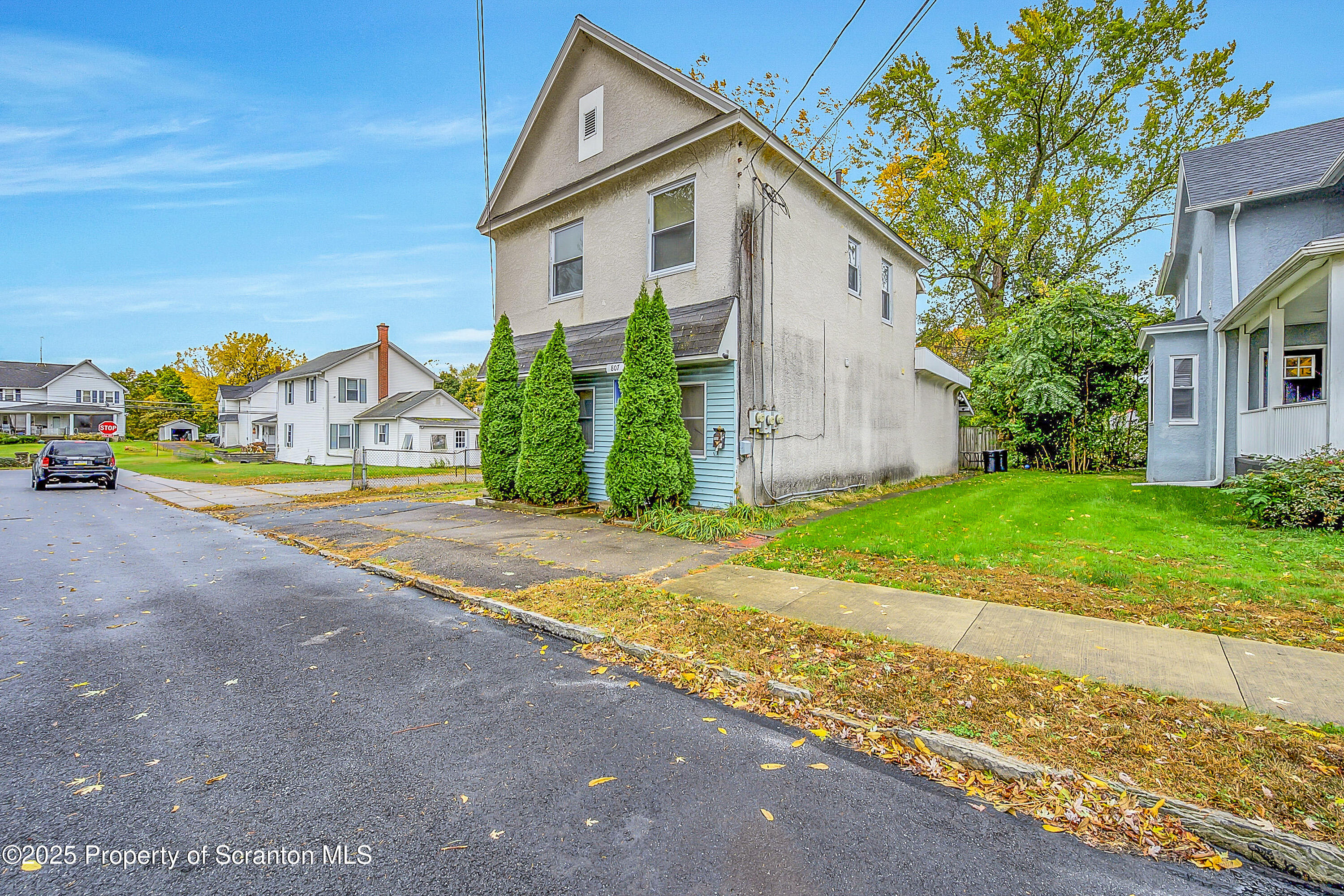 807 Columbus Avenue Blakely, PA 18447 - Photo 2 of 37 a view of a house with a yard and garage