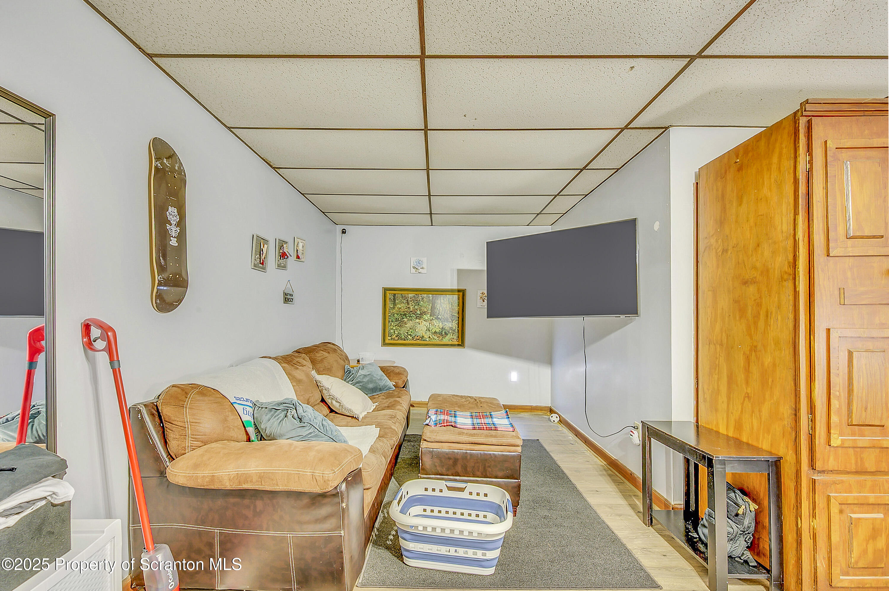 807 Columbus Avenue Blakely, PA 18447 - Photo 21 of 37 a living room with furniture and a flat screen tv