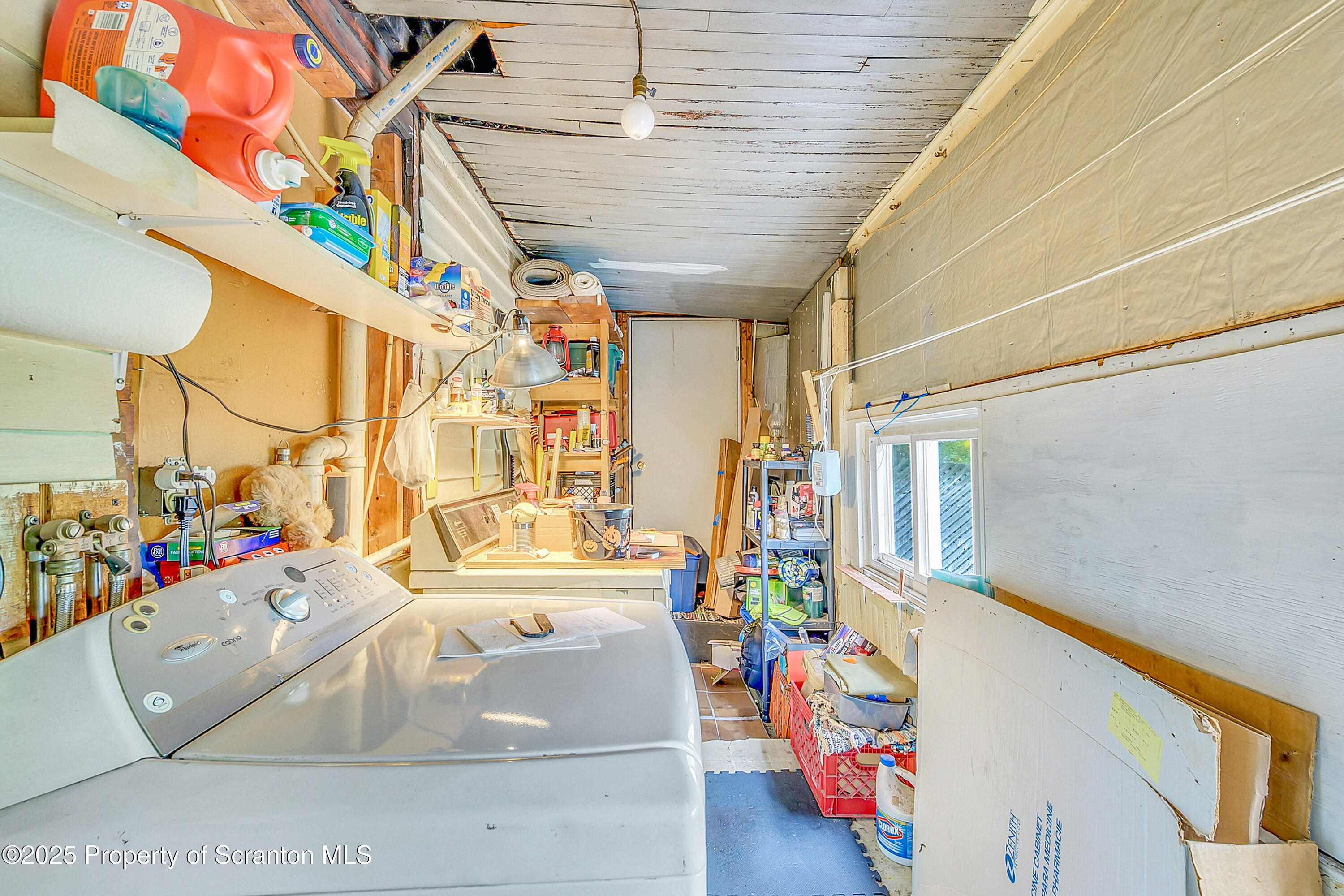 807 Columbus Avenue Blakely, PA 18447 - Photo 26 of 37 a bathroom with a sink a bathtub and a shower curtain