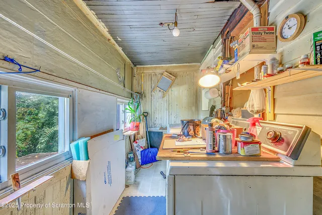 a dining room with furniture and a window