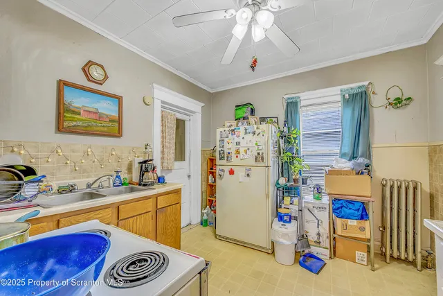 a room that has a bed and a chandelier