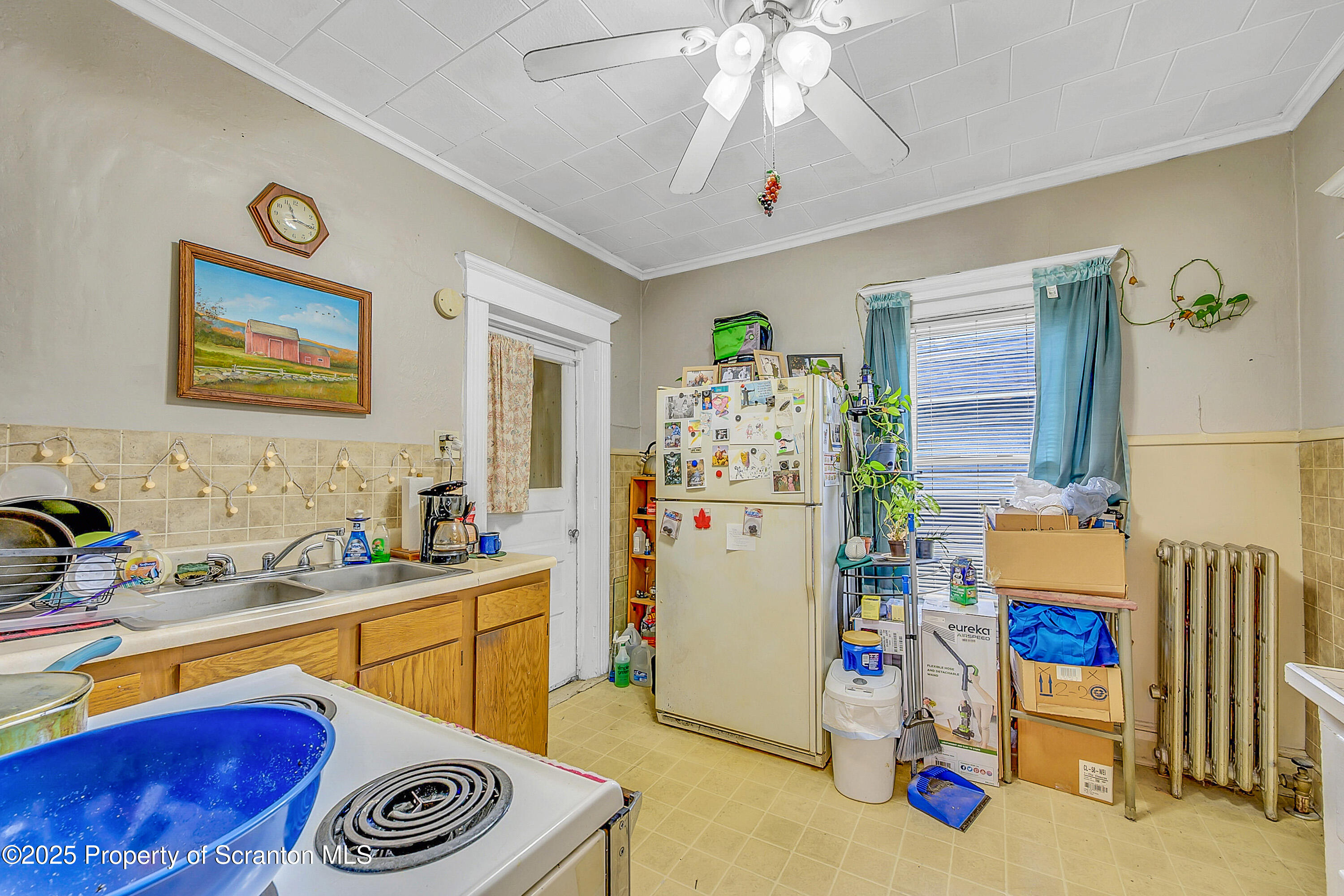 807 Columbus Avenue Blakely, PA 18447 - Photo 30 of 37 a room that has a bed and a chandelier