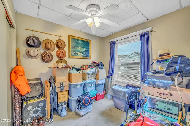 a bedroom with furniture and a chandelier