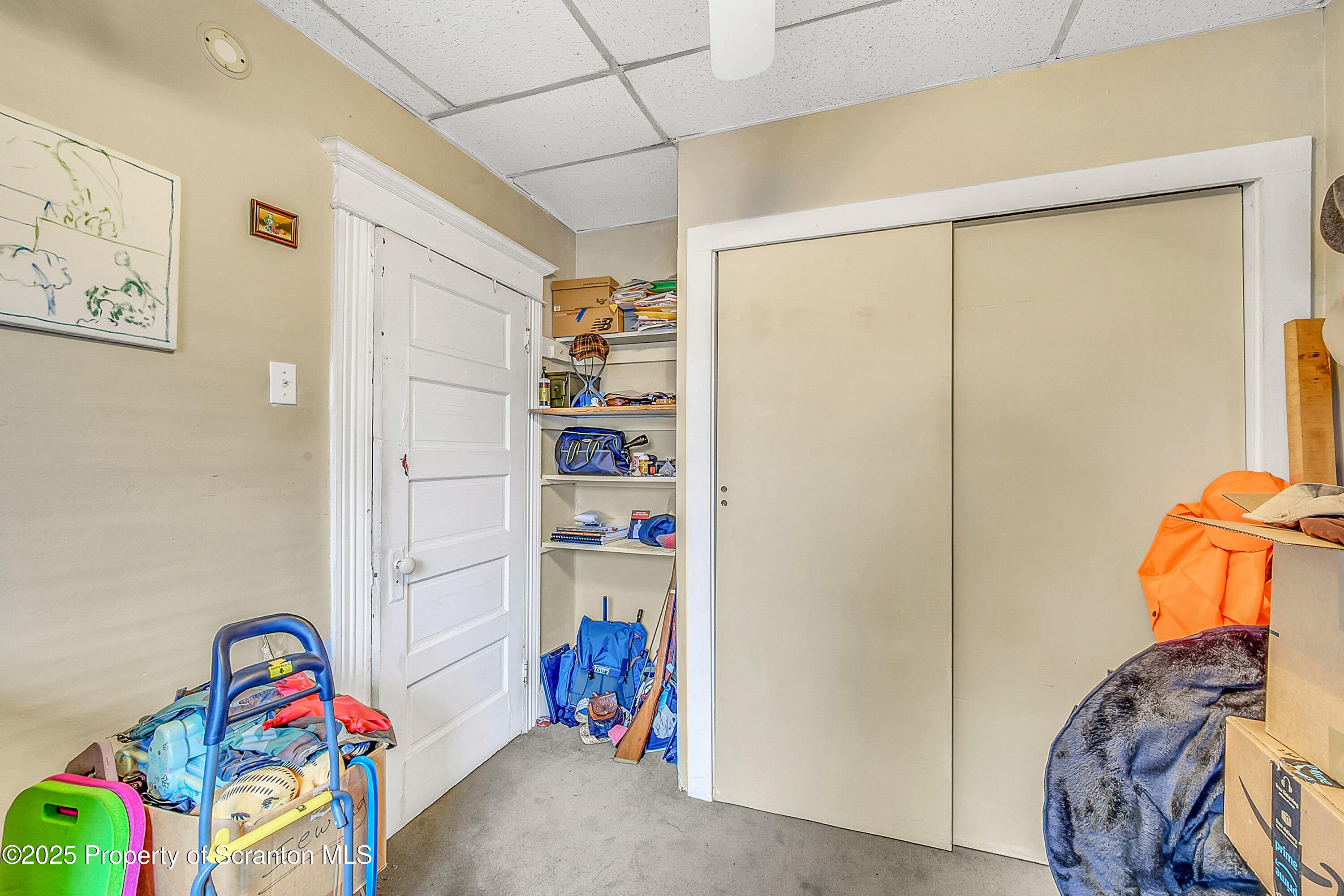 807 Columbus Avenue Blakely, PA 18447 - Photo 32 of 37 a bedroom with a bed and a window