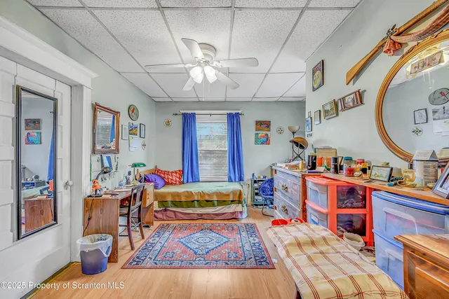 a living room with furniture a rug and a chandelier