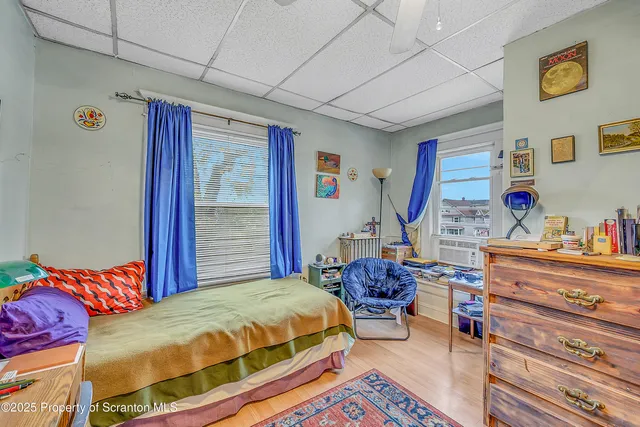 a bedroom with a bed and a table