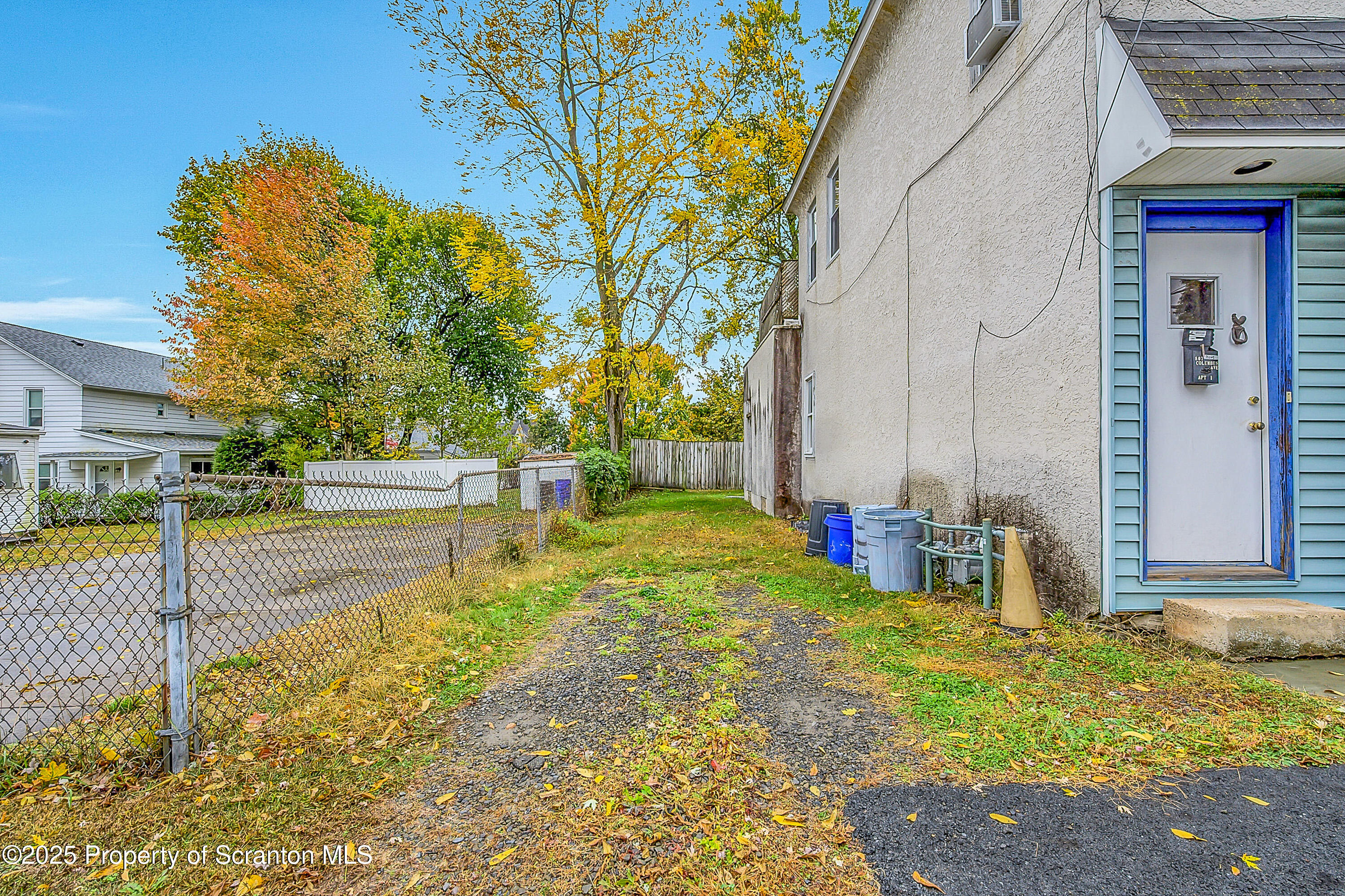 807 Columbus Avenue Blakely, PA 18447 - Photo 4 of 37 a view of a patio with table and chairs and potted plants