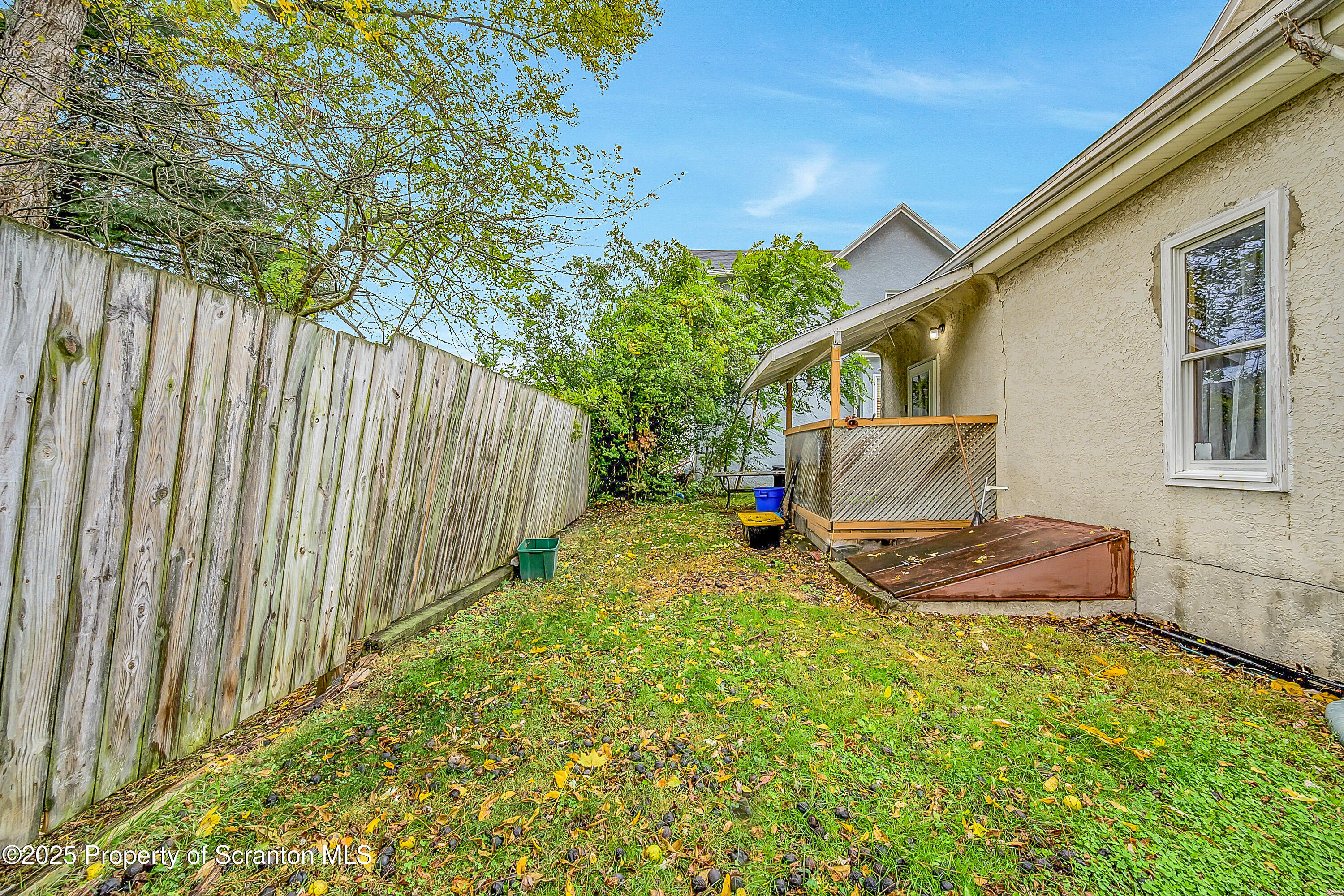 807 Columbus Avenue Blakely, PA 18447 - Photo 6 of 37 a backyard of a house with table and chairs