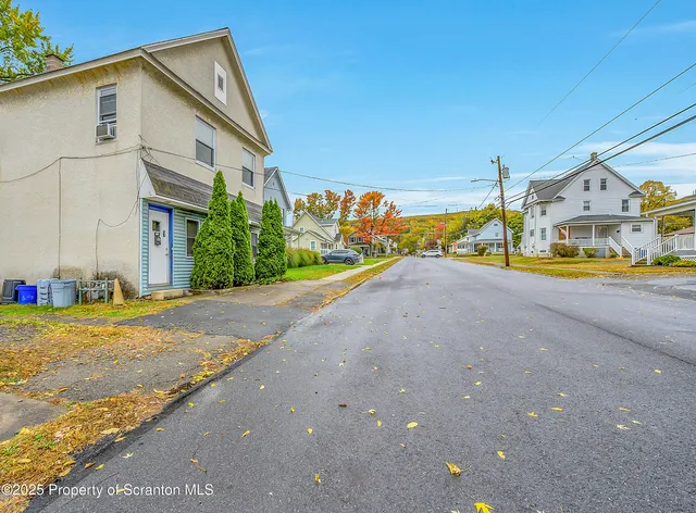 a view of a house with a street