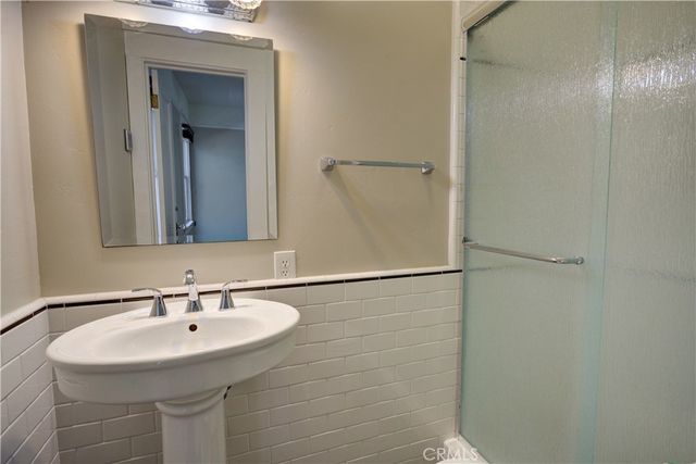 a bathroom with a sink and mirror