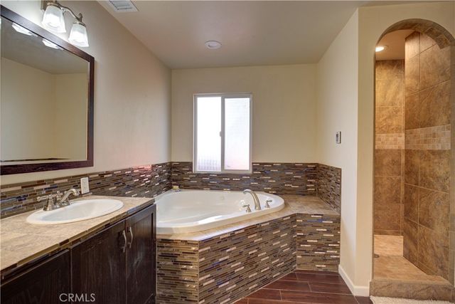 a bathroom with a bathtub and a sink