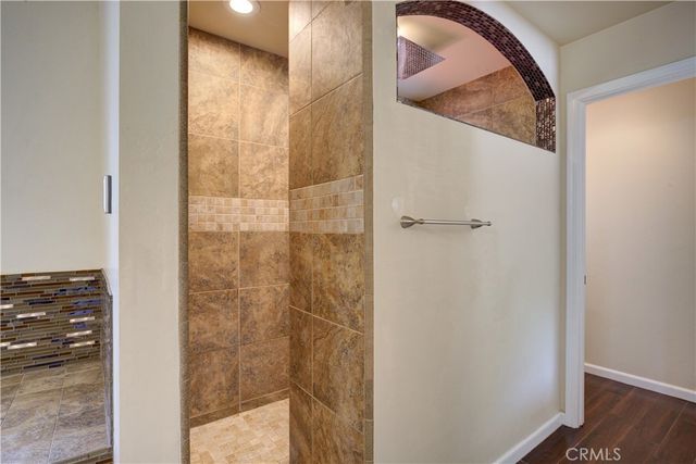 a bathroom with a glass shower door